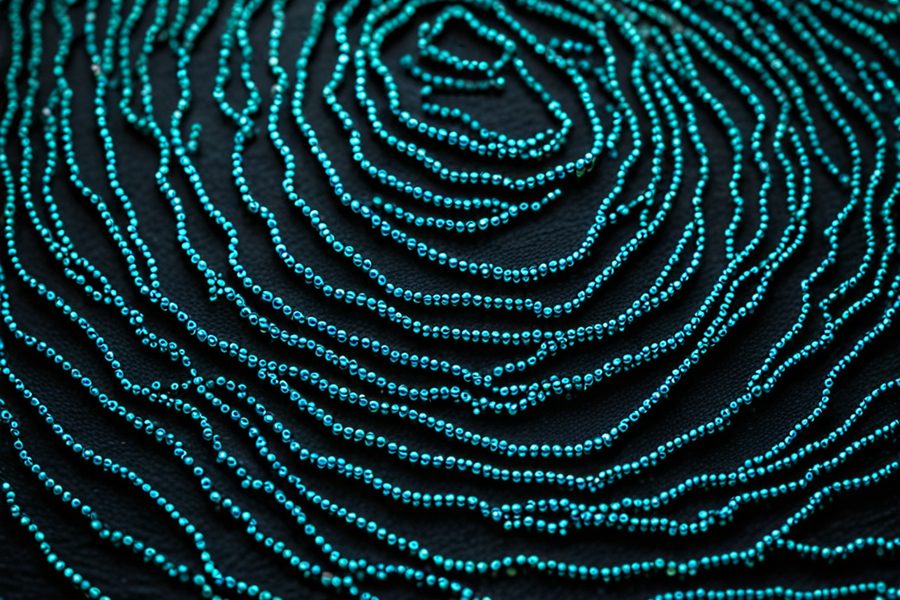 A fingerprint traced in teal beads on black, illustrating identity and tracing for AML and CFT compliance